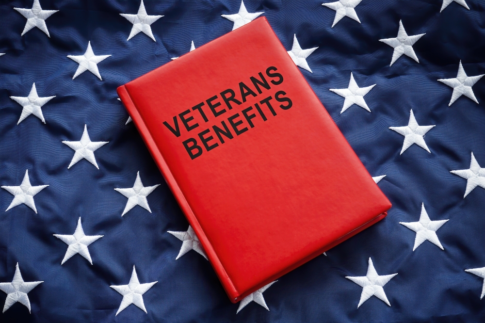 Book veterans benefits on a big flag